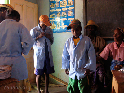 trying on the school uniforms in Madagascar - zahana.org